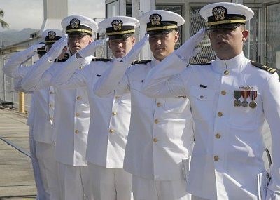 Naval officers in row saluting